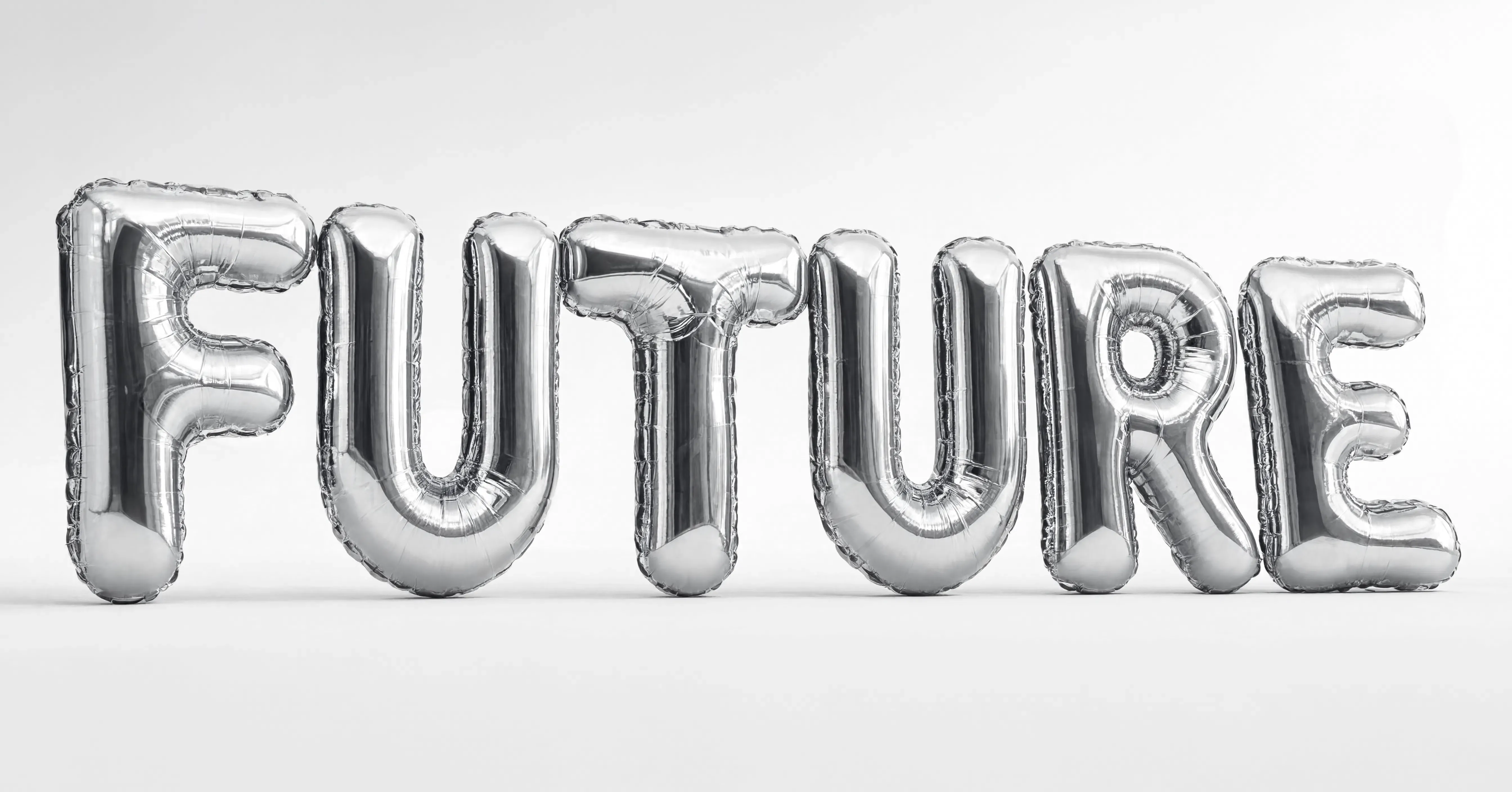 The word FUTURE spelled out in giant liquid chrome balloon letters