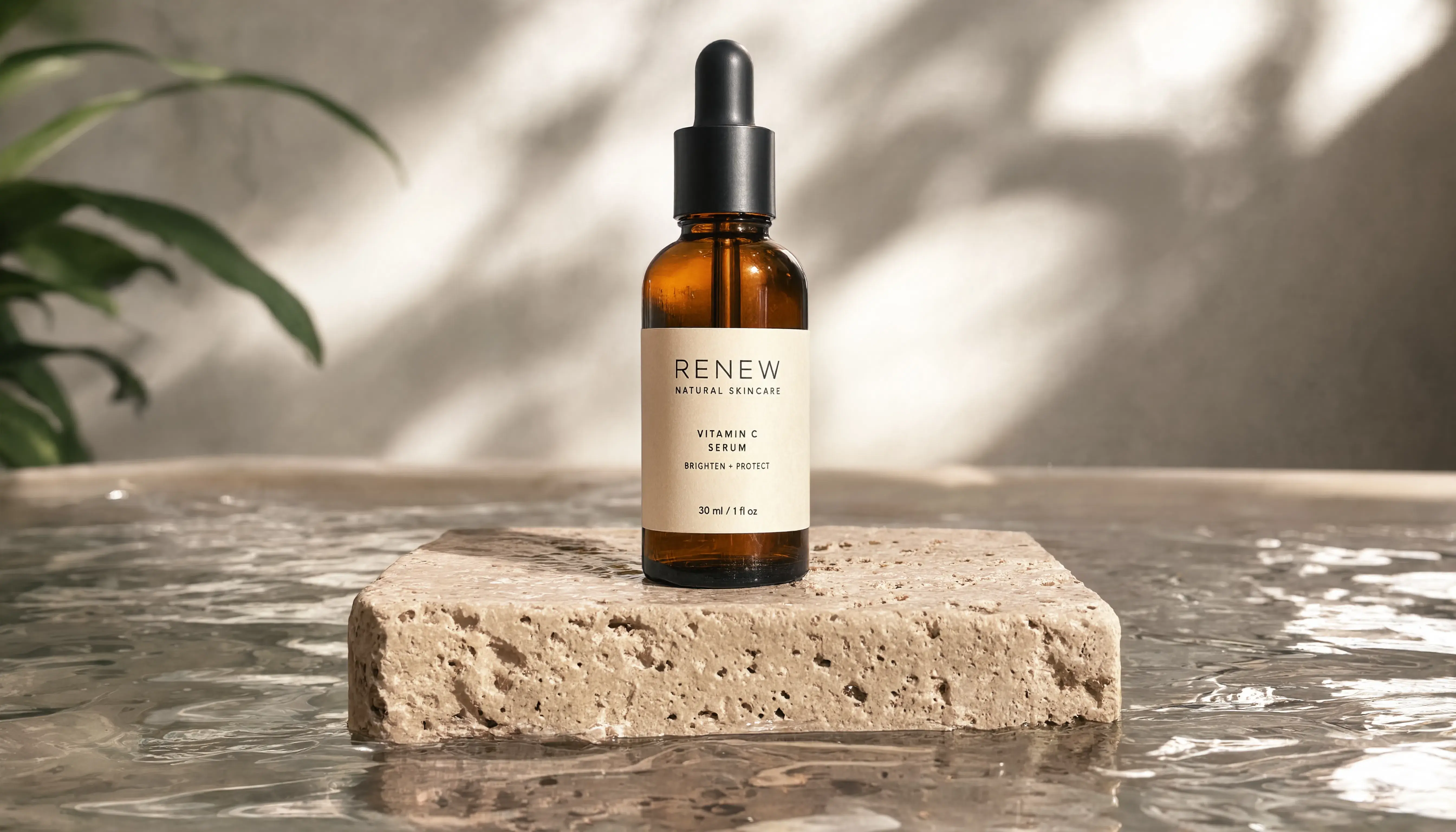 Amber glass dropper bottle sitting on a travertine stone plinth, soft studio lighting